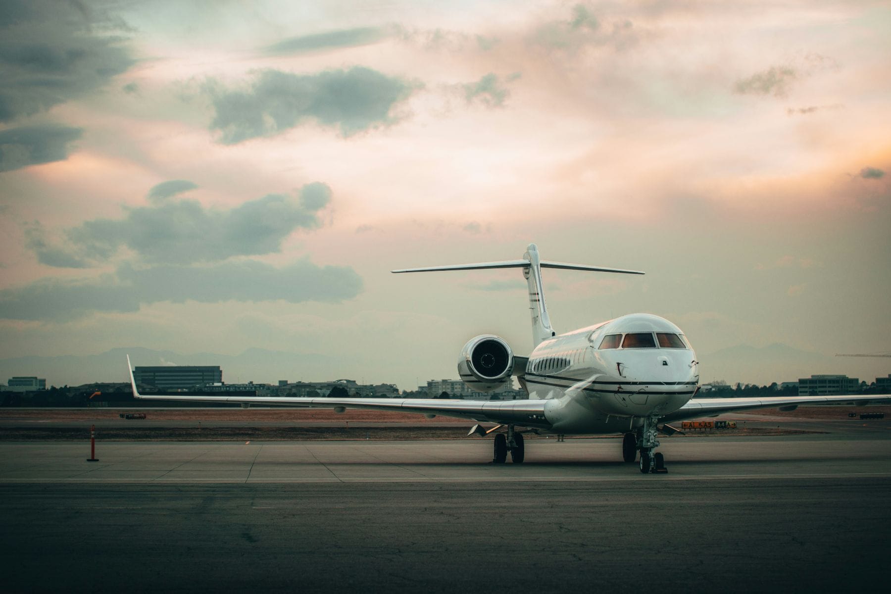 Private jet parked on the ramp at dusk